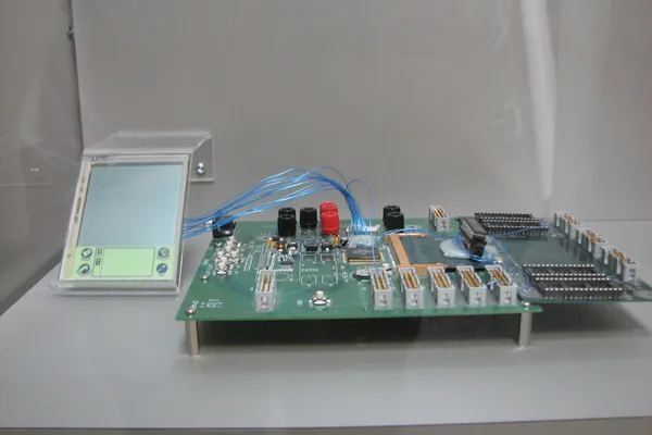Palm Pilot next to the wooden model